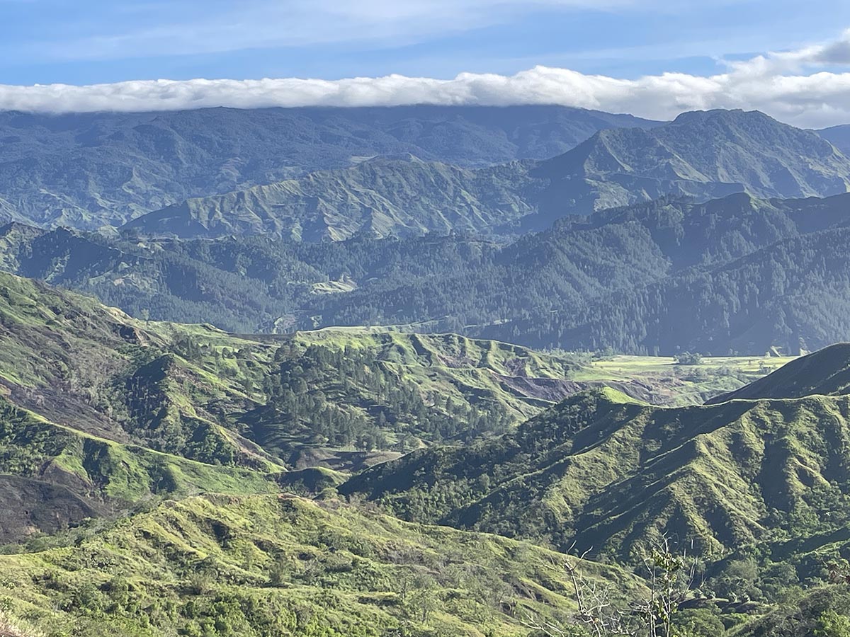 Mindanao, Philippines restoration site overlooking mountains, forests, and clear cut areas